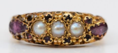 A Victorian 18ct gold amethyst and pearl ring, London 1860, with scroll mount and floral engraved
