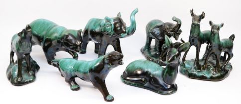 A collection of large Canadian Blue Mountain Pottery animal figures, black with green drip glaze