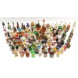 A large quantity of alcohol miniatures to include Gilbeys gin, Pickwick Scotch whisky, Leg Bender-