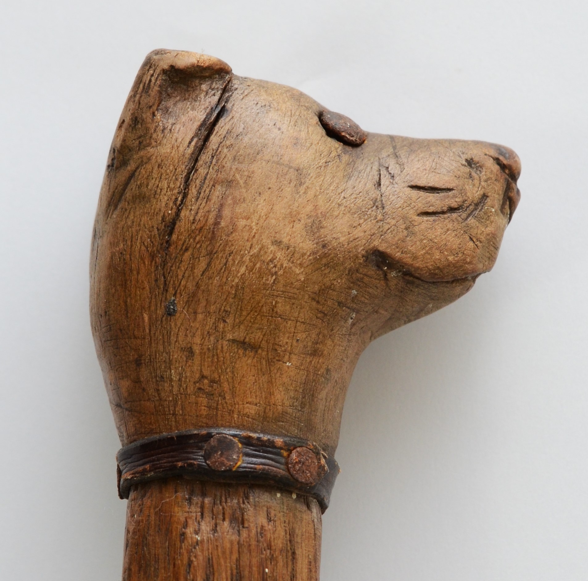 A late 19th century carved fruitwood walking stick, the carved dogs head terminal with glass bead - Image 5 of 6