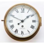 A 20th century ships brass bulkhead clock, having 8-day movement with enamelled dial, roman and