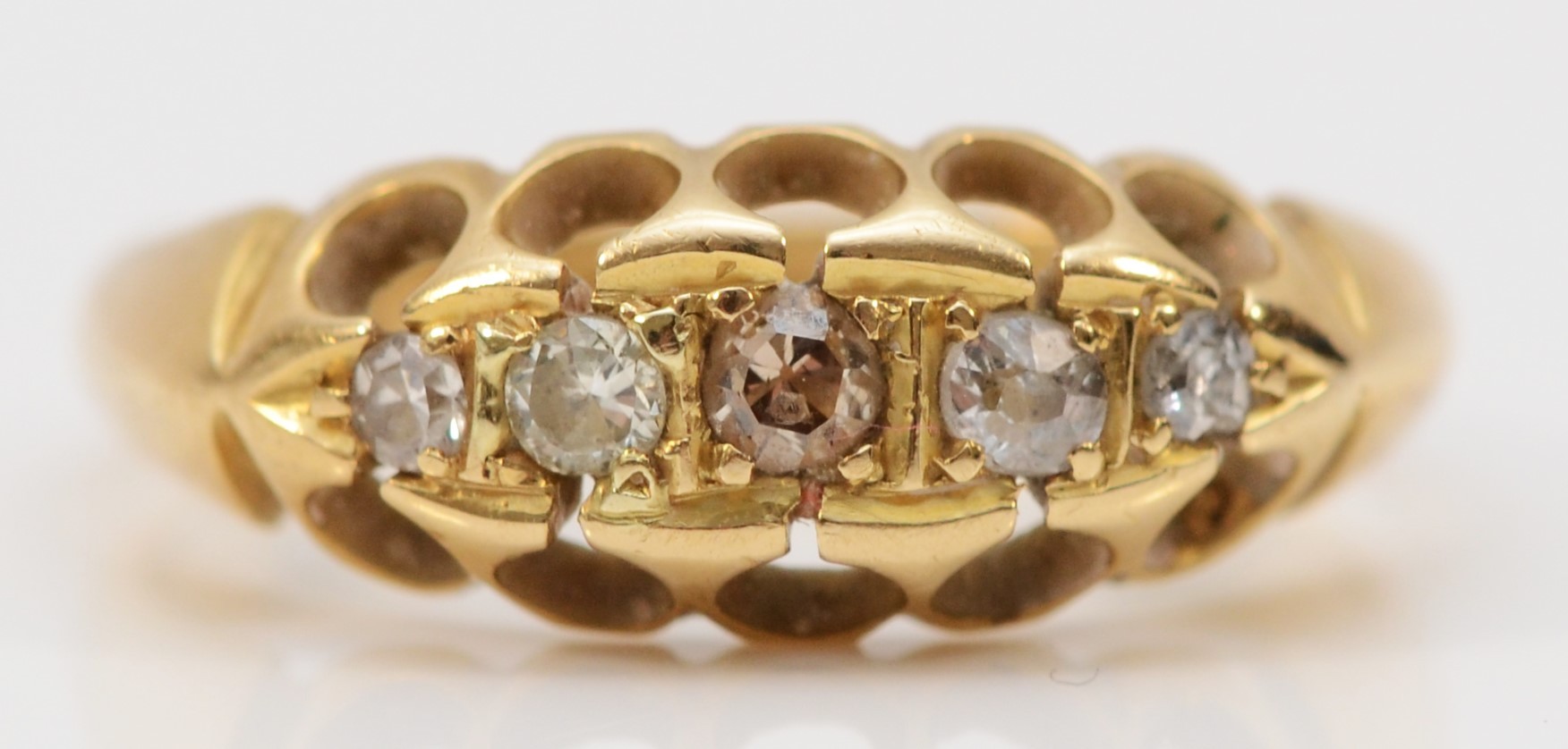 An antique 18ct gold and old cut diamond five stone ring, Birmingham 1913, K, 3gms, one stone a