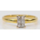 An 18ct gold and Princess cut diamond panel ring, claw set with six stones, stated weight 0.20cts,