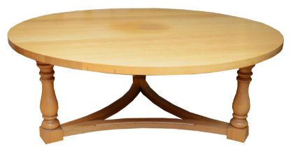 A substantial and impressive modern dining table, light coloured solid oak construction, the rounded