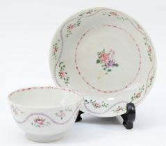 A 19th century Newhall tea bowl & saucer, having floral garland and sprig decoration. (2)