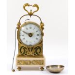 An early 19th century French gilt brass striking mantel clock, the white enamel dial with Roman