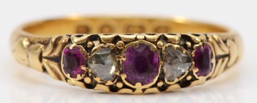 A Victorian 18ct gold, rose diamond and ruby five stone ring, Birmingham 1886, carved shoulders, P