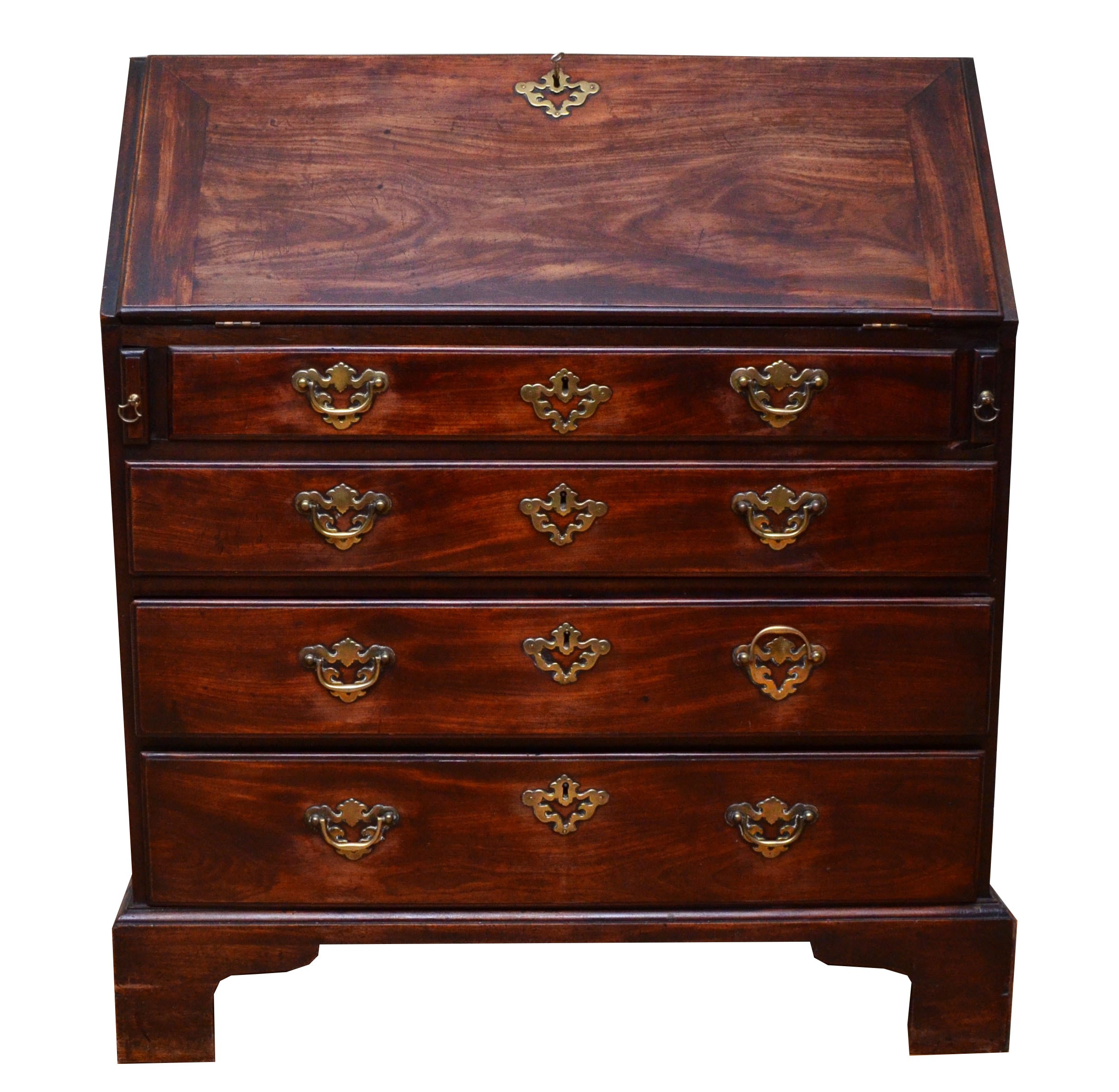 A Georgian mahogany bureau, moulded rectangular fall front with rounded upper corners opening to