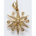 A Victorian 15ct gold and half pearl eight ray star brooch/pendant, detachable bail, 29mm, 4.5gm