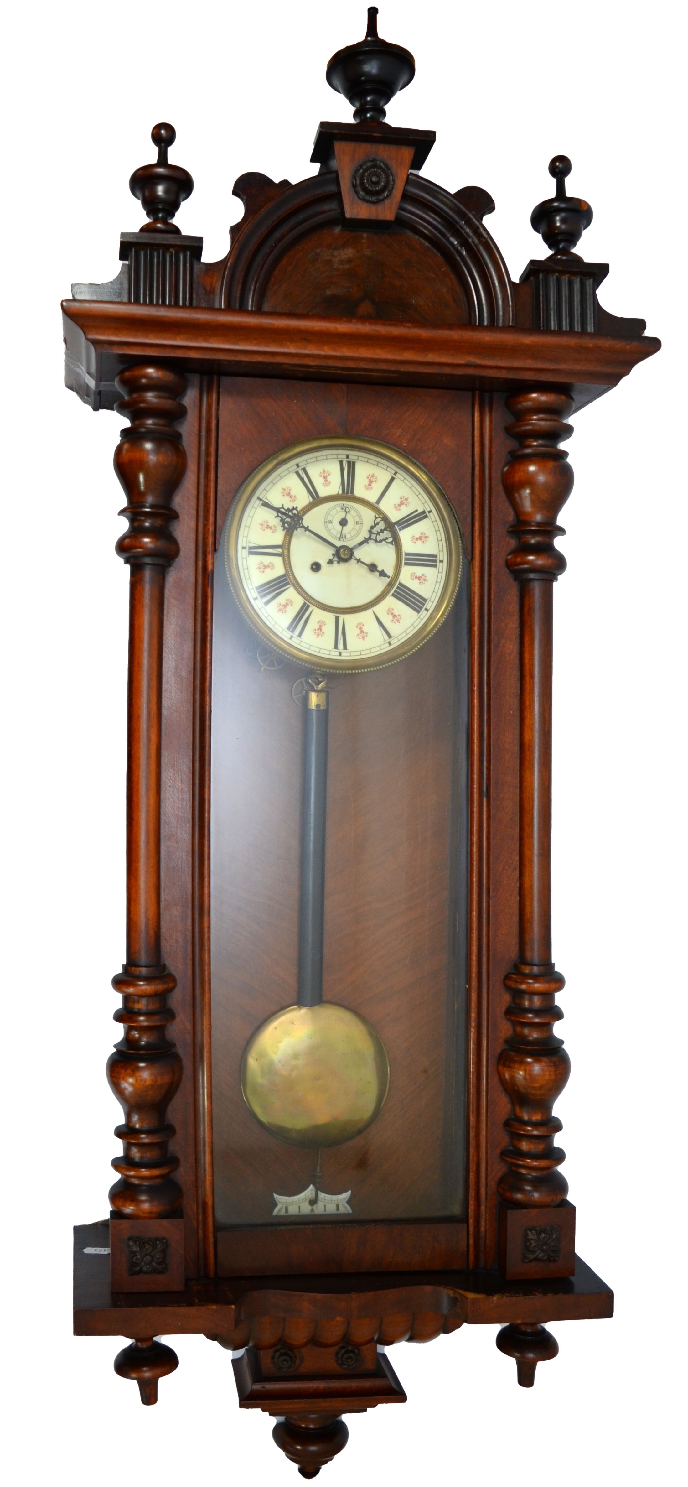 A late 19th century mahogany cased Vienna style wall clock, with arched pediment and turned