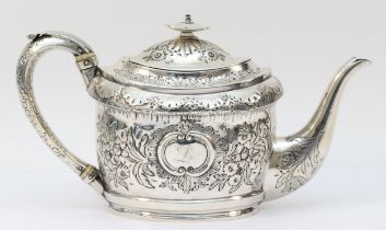 A George III silver tea pot, by John Emes, London 1801, with later embossed and chased decoration,