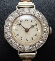 A platinum and diamond maual wind ladies wristwatch, c.1930's, silvered dial with Arabic numerals,