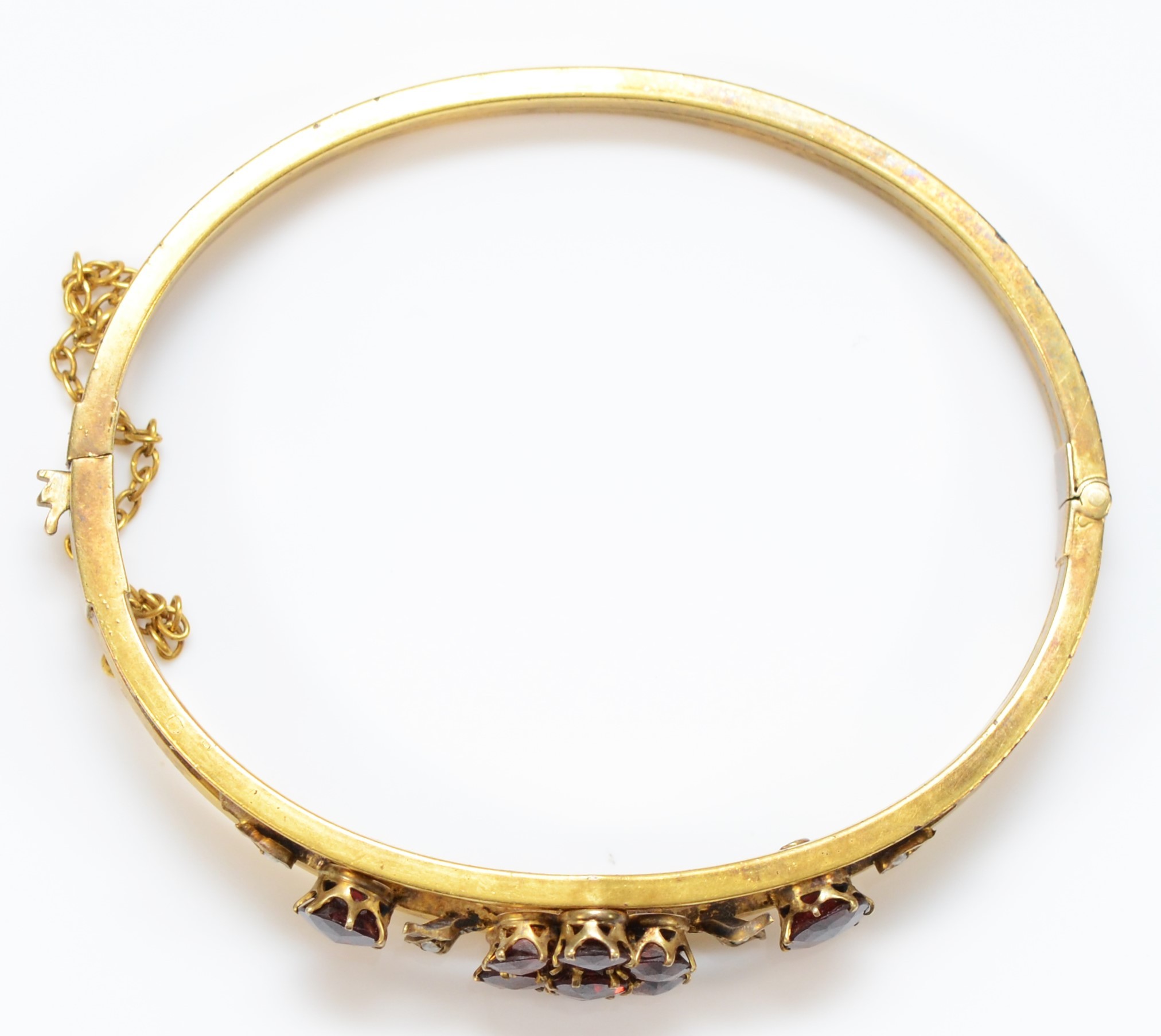 A late 19th century gilt metal and Bohemian garnet cluster bangle, 57 x 47mm. - Image 2 of 2