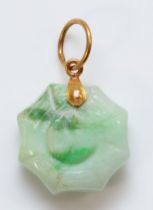 A Chinese gold mounted jadeite Jin/Jan pendant, bordered by a spiders web, diameter 15mm