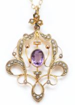 An Edwardian 9ct rose gold amethyst and half pearl openwork scroll pendant, 43mm, 9ct tab, later