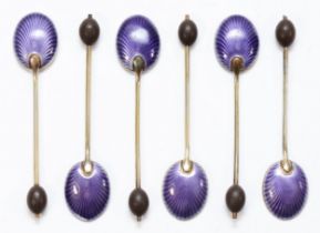 An Art Deco set of silver and enamel bean end coffee spoons, Birmingham 1928, the bowls with