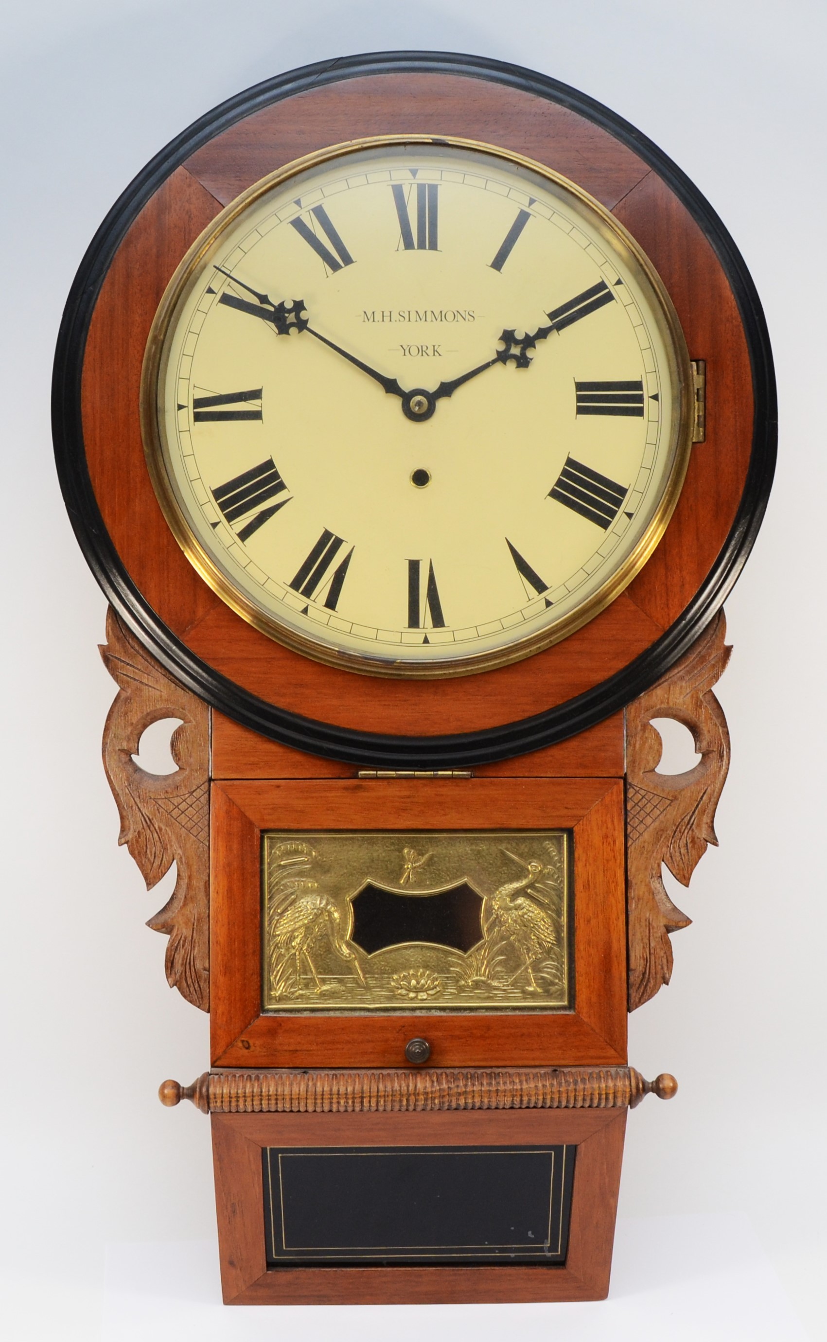 An American drop dial wall clock c1910, with a mahogany and ebonised dial surround and case, box