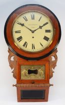 An American drop dial wall clock c1910, with a mahogany and ebonised dial surround and case, box