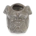 An early 20th century novelty pewter match striker, in the form of a bulldog, 5.5cm tall.