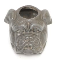 An early 20th century novelty pewter match striker, in the form of a bulldog, 5.5cm tall.