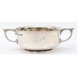 A silver two handled porringer, Sheffield 1915, engraved Ann, 17.5cm across the handles, 255gm