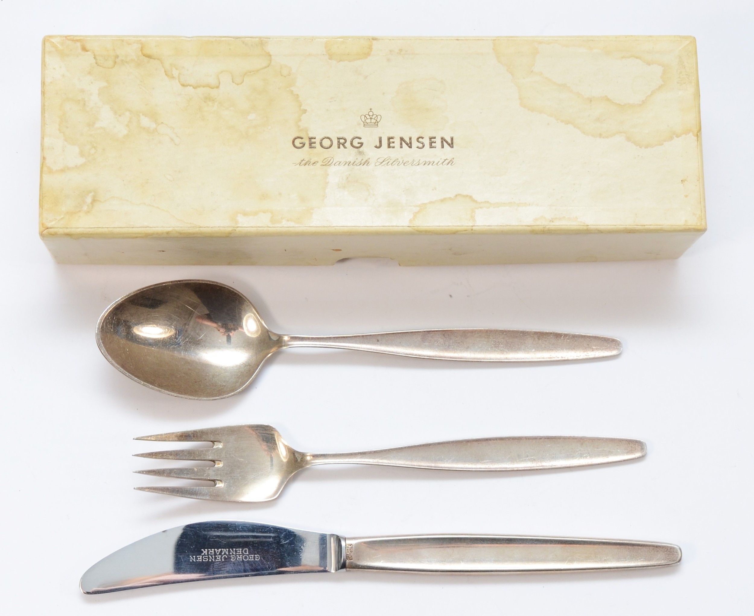 Georg Jensen, a silver three piece christening set, Jensen London import marks 1962, knife 17cm,