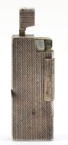 Dunhill, an unusual silver petrol lighter, by Alfred Dunhill & Sons, Birmingham 1975, with engine