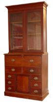 A late 19th century mahogany secretaire bookcase, the top with a stepped pediment over two glazed