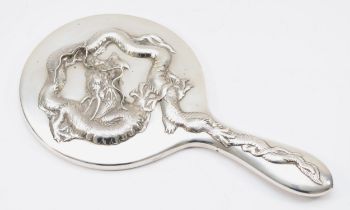 A Chinese silver hand mirror, by Wing Nam & Co, Hong Kong, c.1900/10, with applied four claw dragon,