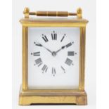 An early 20th century French brass case carriage clock, having white enamelled dial with Roman