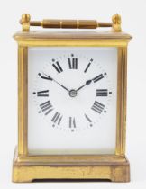 An early 20th century French brass case carriage clock, having white enamelled dial with Roman