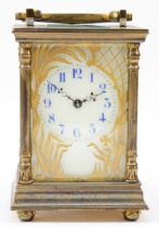 An early 20th century French brass case carriage clock, the painted porcelain dial with blue