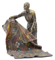 A cold painted bronze model of an Arab carpet seller, signed 'Bergman' with foundry stamp, 19cm