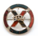 A Victorian Scottish silver and polished agate brooch, the central cross with stone set crown,