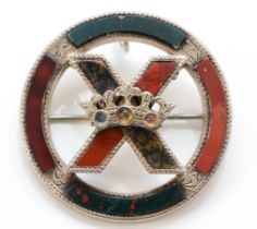 A Victorian Scottish silver and polished agate brooch, the central cross with stone set crown,