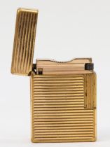 S.T. Dupont, Paris, a gold plated gas lighter, N5156, with ribbed body, 4.6cm