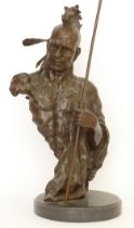 A large bronze bust of a native American Indian Chief holding an arrow, signed 'Nick', raised on a