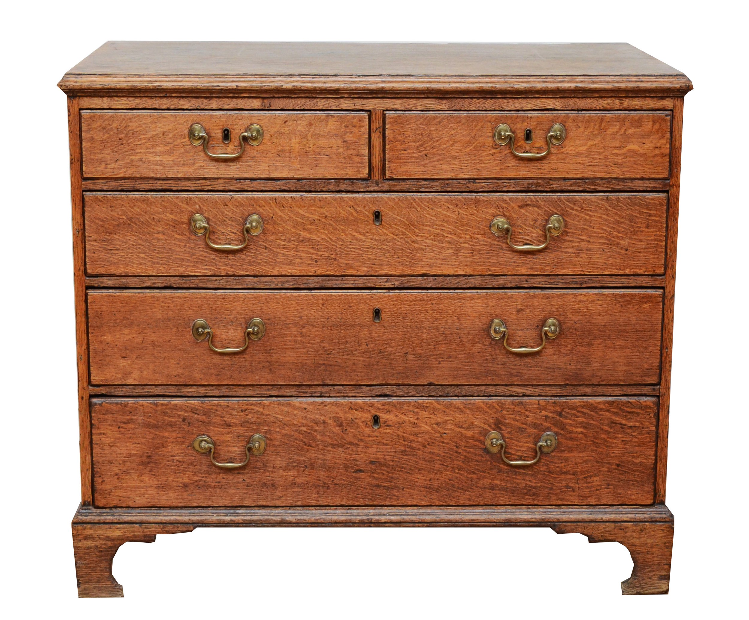 A late 18th century Georgian oak chest, the moulded edged top over two short and three long