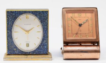 A 1920s Art Deco Jaeger traveling alarm clock, plated copper folding case, the dial stamped Jaeger