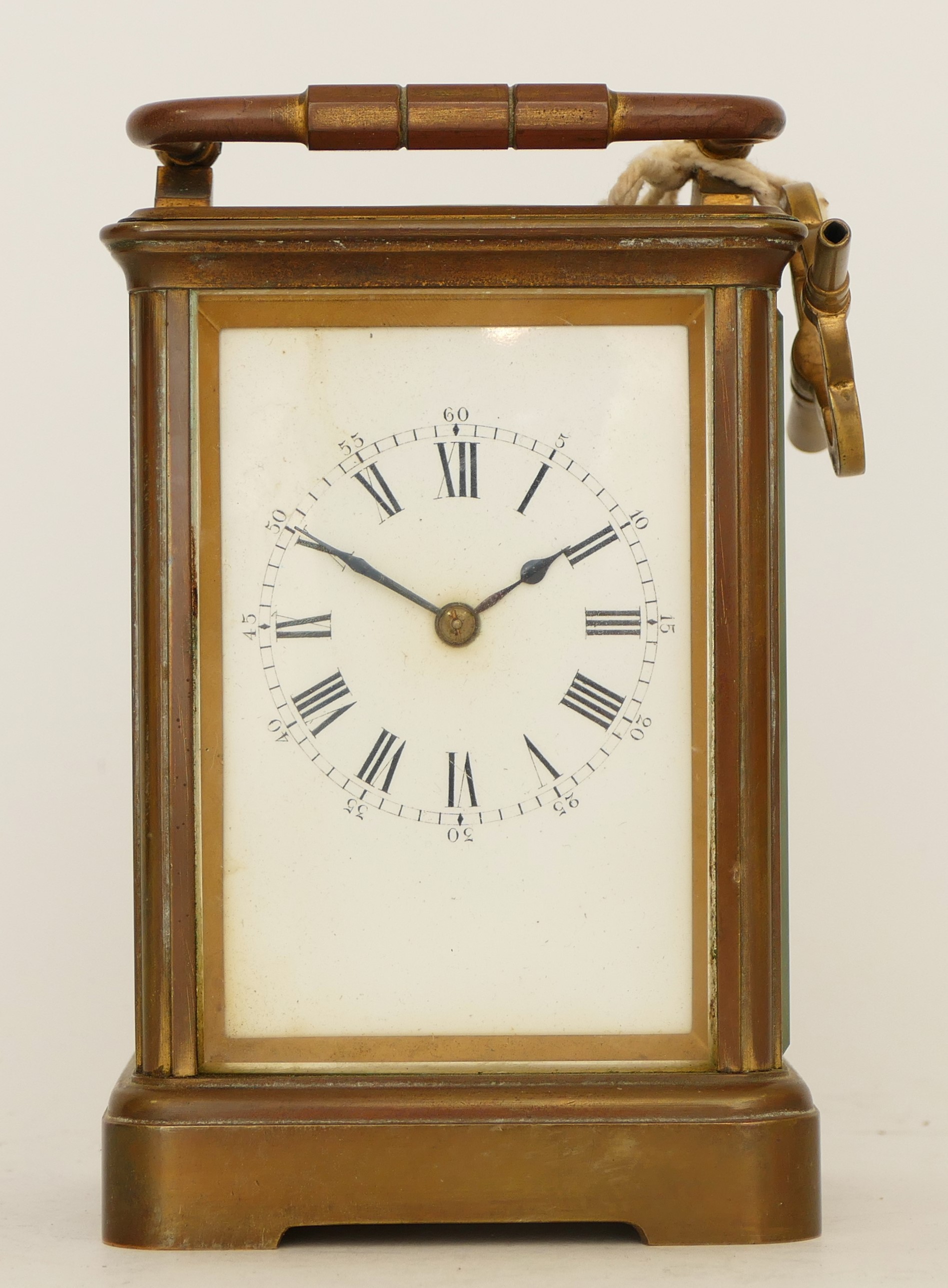 A 20th century gilt brass 8 day carriage, the enamelled white dial with Roman numerals, movement