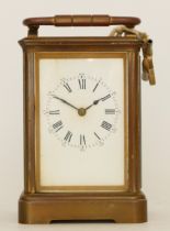 A 20th century gilt brass 8 day carriage, the enamelled white dial with Roman numerals, movement