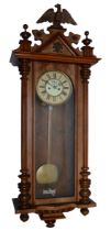An early 20th century Vienna style wall clock, mahogany and walnut veneered case with carved