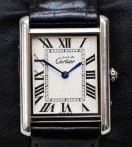 WITHDRAWN. Cartier, de Must, a silver quartz gentleman's wristwatch, black Roman numerals,