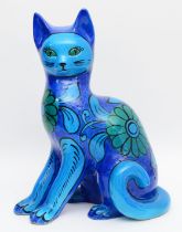 A large 1960s Mario Bellini ceramic sculpture of a seated cat, having painted turquoise and blue fl