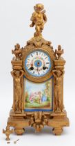 A French gilt ormolu mantel clock, late 19th Century, surmounted with cherub, over two figural