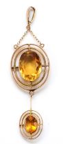 An Edwardian 9ct rose gold and citrine pendant, the main stone 16 x 11mm, overal length 70mm, 6.5gm