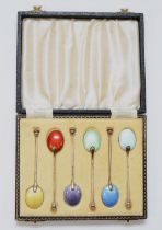 A silver gilt and enamel set of seal top coffee spoons, Birmingham 1955/6, with guilloche enamel