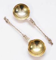 A Victorian silver pair of serving spoons, no maker, Birmingham 1896, with cast St. Peter handles,