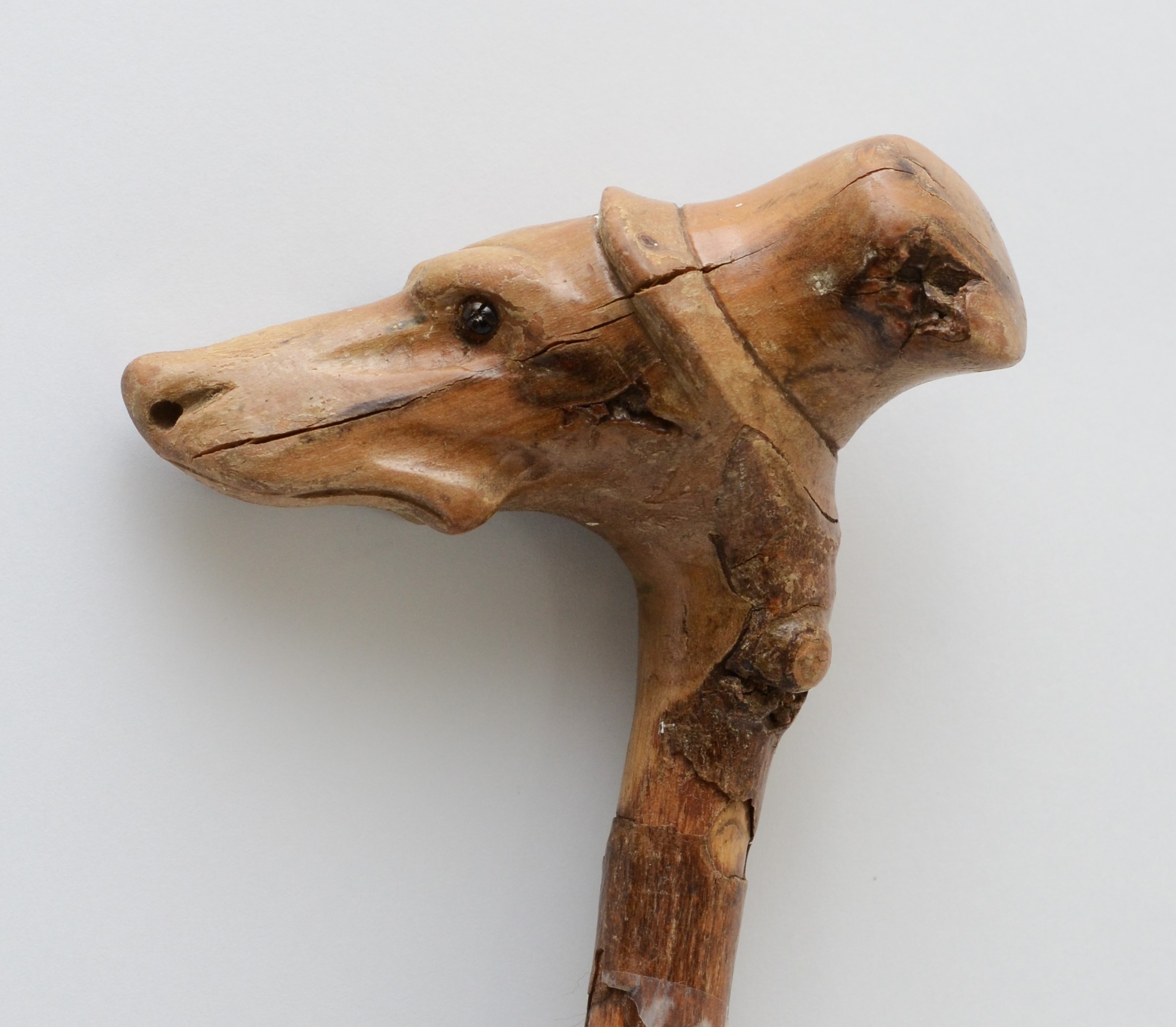 A late 19th century carved fruitwood walking stick, the carved dogs head terminal with glass bead - Image 3 of 6