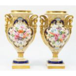 A pair of 19th century English porcelain vases, each painted with floral bouquet within a gilt